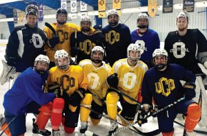 UCO hockey team smiling for group photo