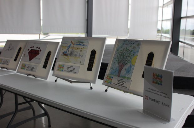 winners of drawing for dollars contest on display